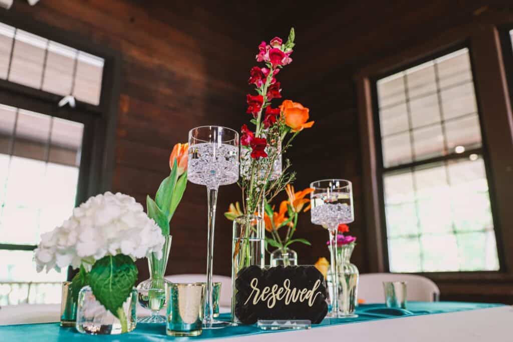 Beautiful floral centerpiece with roses and lilies for wedding reception.